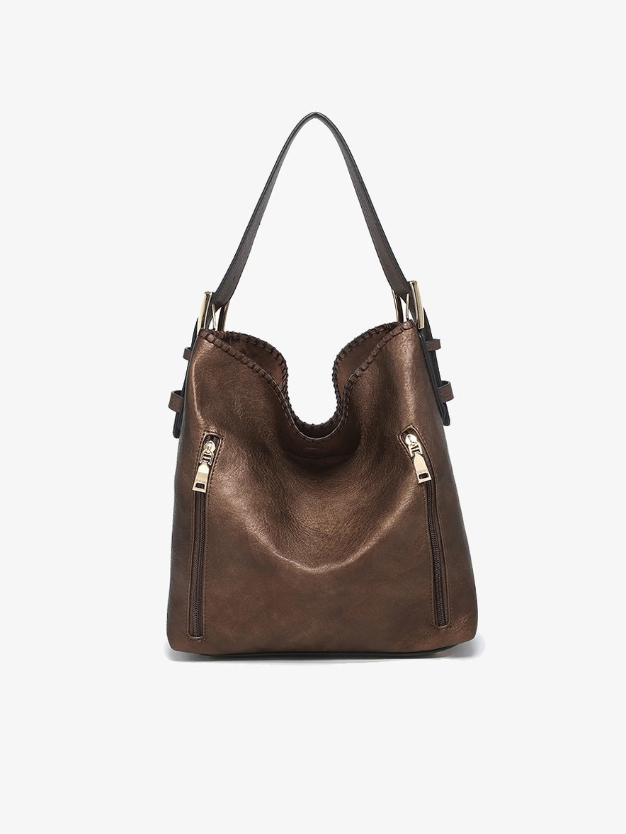 The Alexa 2-in-1 Hobo Bag offers both style and functionality. It features dual zip compartments, including concealed carry pockets for added security. The adjustable buckle shoulder strap ensures a comfortable fit, while the magnetic snap closure provides easy access to your belongings. Additionally, the inner bag with slip and zip pockets offers organized storage, and the adjustable/removable crossbody strap adds versatility to your carrying options.